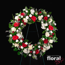 Load image into Gallery viewer, Custom standing wreathe with red and white roses, a perfect floral tribute by a florist in Scottsdale.